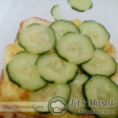Place the omelette following by the cucumbers.