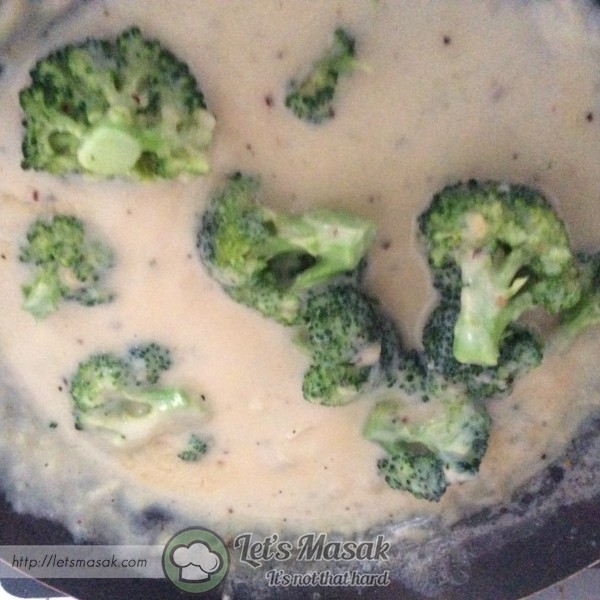 Add the broccoli and simmer for around 20 minutes, or until the broccoli is cooked through and starts to break down, then mash